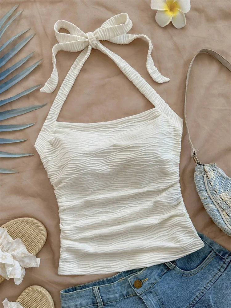 Top corto con cuello Halter de Color liso con diseño de onda para mujer, camisola Sexy con cintura fruncida y espalda descubierta, camiseta sin mangas, ropa de calle Y2k