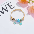 Pulsera Dijes Gato Flor Corona | Brazalete Acero Inox. Color Dorado | Regalo Navidad | Ticotrendy